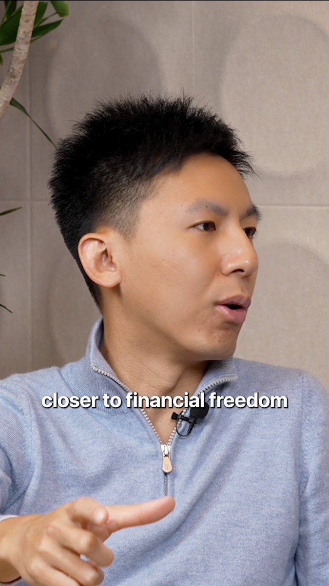 The image features a man wearing a blue shirt who appears to be giving instructions or explaining something related to finance. The text "closer to financial freedom" can be seen, which suggests that the man might be discussing ways to improve one's financial situation or providing advice on managing money more effectively.