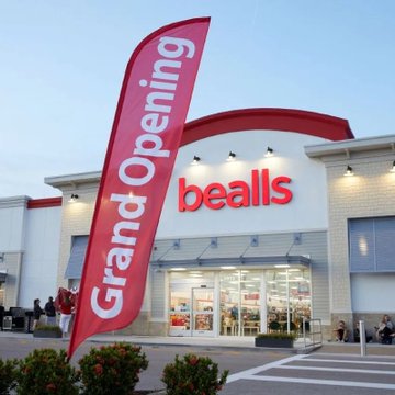 A Beals retail store is shown with a large red "Grand Opening" flag displayed in front of the entrance.