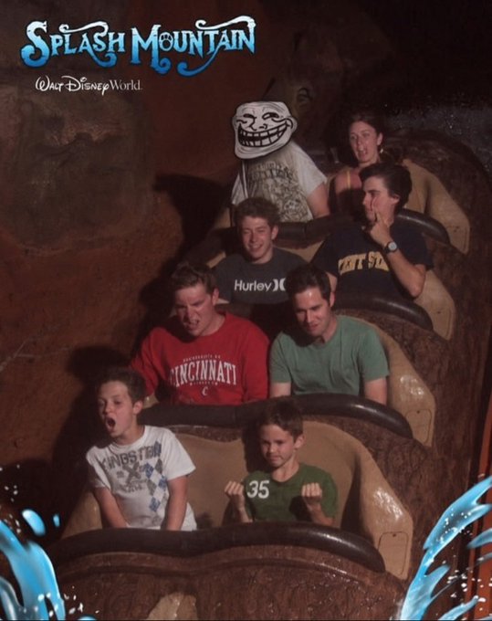 A group of riders experience the "Splash Mountain" ride at Walt Disney World, with a Trollface meme edited over one person's head, tying into the post's joke about the Trollface meme's widespread presence and potential as a Solana token. Visible text includes "Splash Mountain @Walt Disney World," a "Hurley" shirt, a "Cincinnati" shirt, and a "35" jersey.