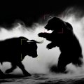 Dark silhouettes of a bull and bear face off against a misty black background, with red and yellow candles forming the outlines of the two animals.