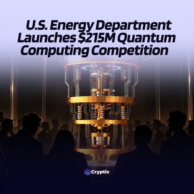 A silhouetted crowd gazes at a towering, golden quantum computer glowing in the center of the image, beneath the bold headline "U.S. Energy Department Launches $215M Quantum Computing Competition," with a "Cryptic" logo at the bottom, visually reinforcing the post's announcement of the Department of Energy's major investment in fault-tolerant quantum computing.