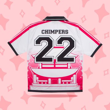 A white, red, and black soccer-style jersey displayed against a pink starry background, featuring "CHIMPERS" and the number "22" on the back, with a graphic resembling a Japanese dojo's interior on the lower half. The image illustrates the post's description of the Chimpers collection's away kit, highlighting the "22" marking the 2022 minting year and the dojo tribute design on the back.