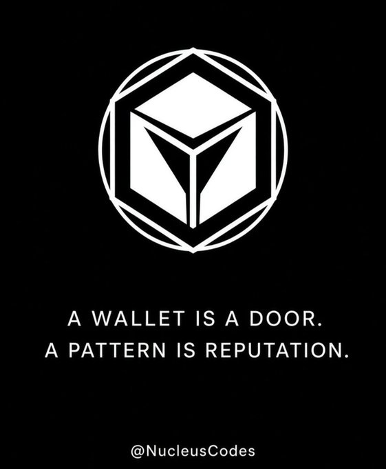 A black poster featuring a geometric logo of a 3D cube within a hexagon, with the text 'A WALLET IS A DOOR. A PATTERN IS REPUTATION.' and the handle '@NucleusCodes' at the bottom.
