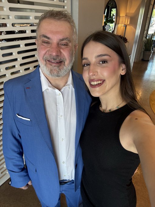 The image features two people standing next to each other - one person wearing a blue suit jacket and the other dressed in black. They are both smiling for the camera, with Klaudia, who appears to be a woman, being identified as the new Scientific Bitcoin Institute Operation Manager.

The post is titled "Klaudia is our new Scientific Bitcoin Institute Operation Manager, please give her a follow and welcome her to the Bitcoin community." The image also includes text that reads: "Klaudia is our new Scientific Bitcoin Institute Operation Manager, please give her a follow and welcome her to the Bitcoin community."