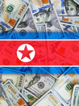 Image showing the North Korean flag overlaid on a background of scattered U.S. dollar bills.