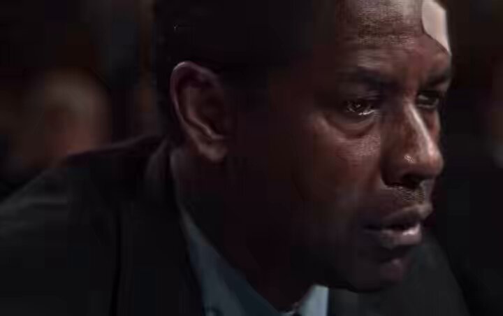 The image shows a man with short hair wearing a suit, sitting down looking sad or concerned, possibly in an office setting. The surrounding scene suggests that he might be having a serious conversation about the future of Bitcoin or a similar digital currency.