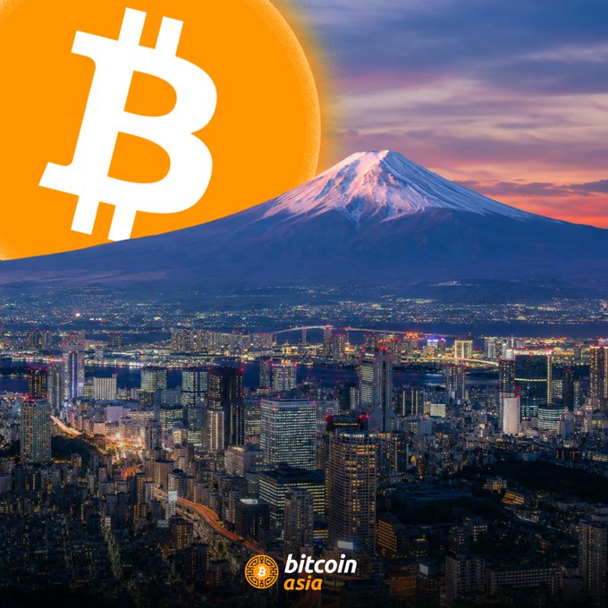 The image shows an orange logo for Bitcoin Asia with a cityscape in the background, likely Tokyo. In the foreground of the image, there's a mountain range with a large volcano at its peak. The city buildings are located throughout the frame, showcasing a vibrant urban landscape. The post discussing Bitcoin suggests that Japan is taking advantage of the growth and benefits of digital currency by advocating for lower taxes on Bitcoin and crypto assets in their country.