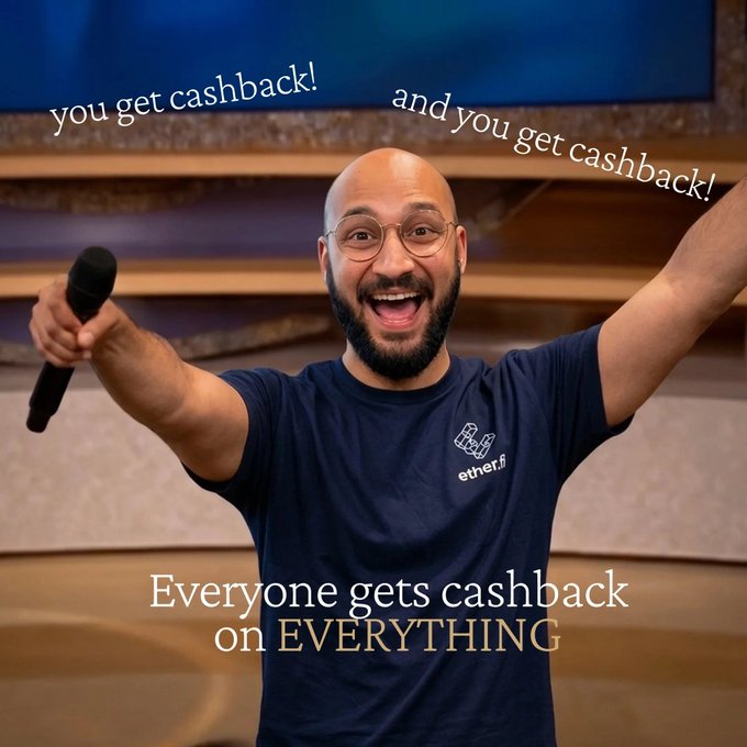 An excited bald man with glasses and a beard, wearing a navy blue "ether.fi" t-shirt, raises his arms joyfully while holding a microphone. The image features text reading "you get cashback!" and "and you get cashback!" along with "Everyone gets cashback on EVERYTHING," visually emphasizing the platform's universal cashback rewards system highlighted in the post.