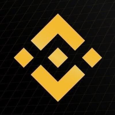 A digital rendering of the Binance logo, featuring gold geometric shapes resembling a diamond on a black grid background.