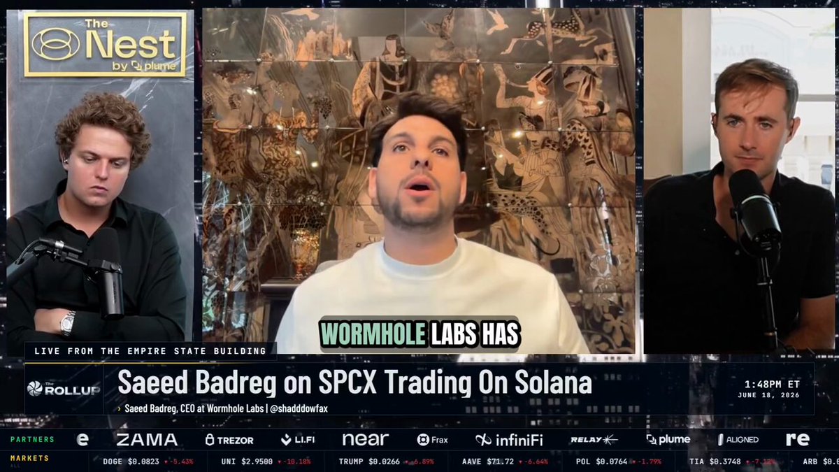 The image shows three men sitting behind microphones at a podcast recording session. The hosts are discussing the topic of SPX trading on Solana, with one man appearing to be an expert or co-founder of Rockstar Studios. The other two men seem to be listening intently as they record the podcast.