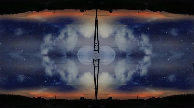 A symmetrical, mirrored image of a starry night sky with glowing moon-like orbs and a silhouetted tower or antenna structure in the center.