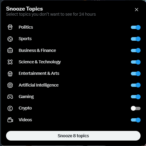 A dark-themed "Snooze Topics" interface allowing users to mute topics like Politics, Sports, Business & Finance, Science & Technology, Entertainment & Arts, AI, Gaming, Crypto, and Videos for 24 hours.