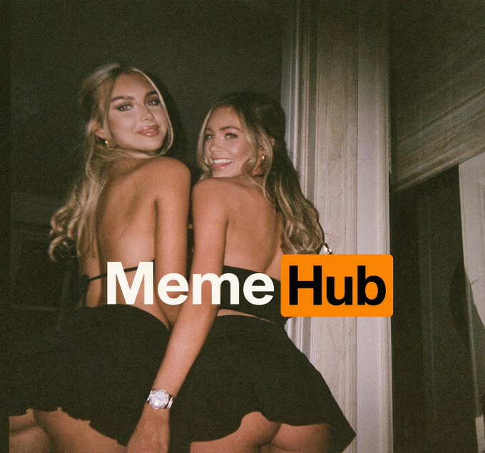 Two women in matching black outfits posing back-to-back, with a 'MemeHub' logo watermark overlaid on the image.