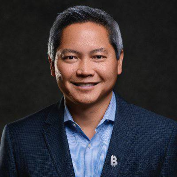 A professional headshot of a smiling middle-aged man in a navy blazer over a light blue shirt, wearing a Bitcoin "₿" lapel pin. The image likely depicts **Phong Le**, whose quote on $STRC retail and institutional ownership trends accompanies the post.