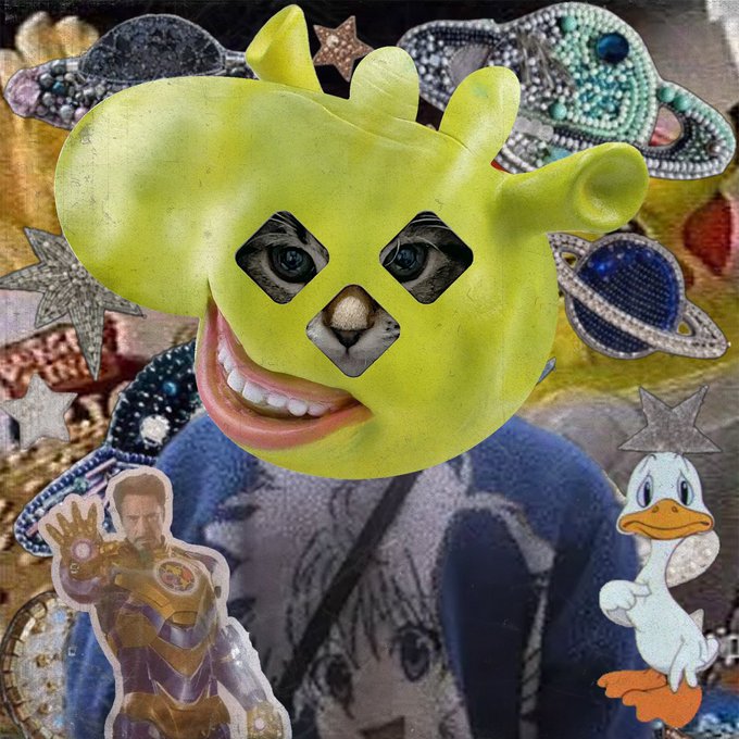 A surreal digital collage features a large yellow Shrek-like head with human eyes and a smiling mouth, surrounded by cutouts of Iron Man, Donald Duck, stars, and other eclectic elements.