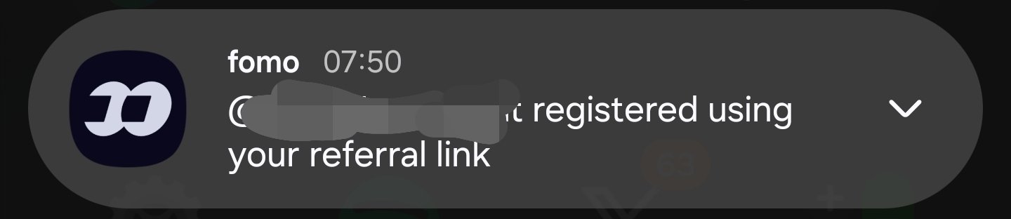 A dark notification bubble shows the 'fomo' logo and text reading '[Name blurred] registered using your referral link' at 07:50.
