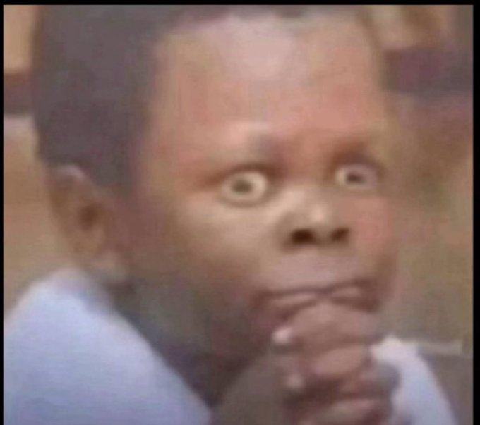 A close-up of a child with wide, worried eyes and hand near mouth in a look of shock or concern. The image visually captures the reaction expressed in the post—surprise and disbelief at an account posting numerous GM (good morning) messages.