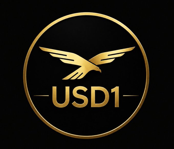 A gold and black logo featuring an eagle with spread wings above the text 'USD1' inside a circular border.
