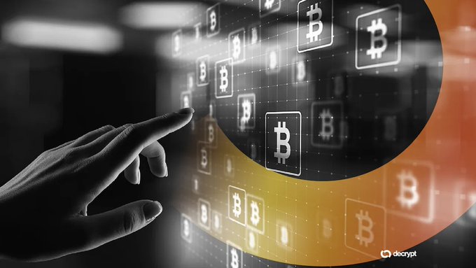An artistic image of a hand reaching toward a grid of Bitcoin logos with an orange and black curved background, watermarked "decrypt".
