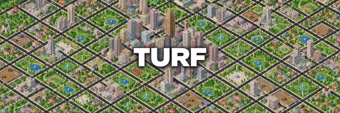 Banner-style promotional image for 'TURF' displayed over an isometric pixel-art cityscape with skyscrapers, parks, and highways arranged in a grid pattern.