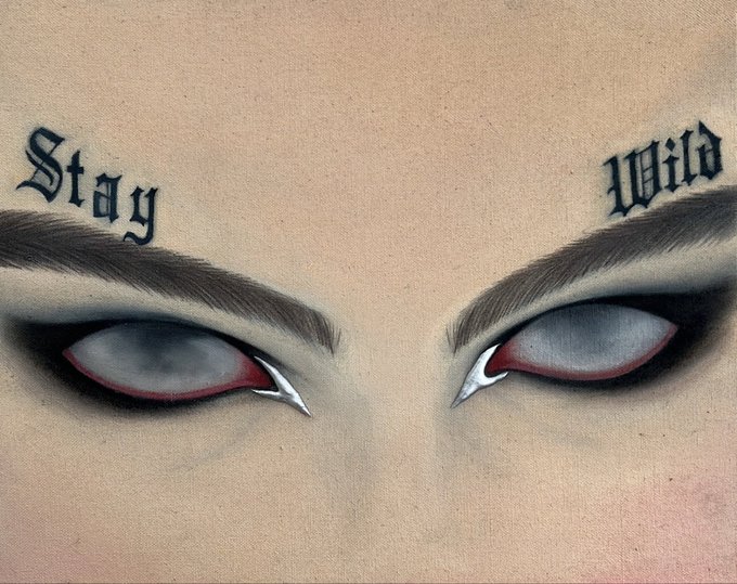 A digital illustration of intense eyes with red sclera, eyebrow tattoos reading 'Stay' and 'Wild', and silver fang-like accents on the inner corners, suggesting a vampire or demonic aesthetic.