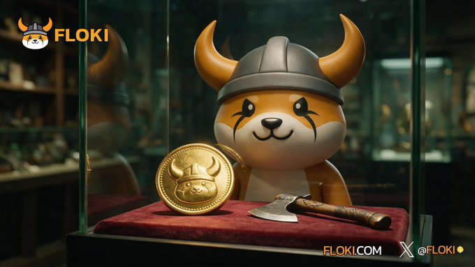 FLOKI cryptocurrency promotional image showing the Viking-helmeted dog mascot displayed in a glass case alongside a gold FLOKI coin and a small axe.