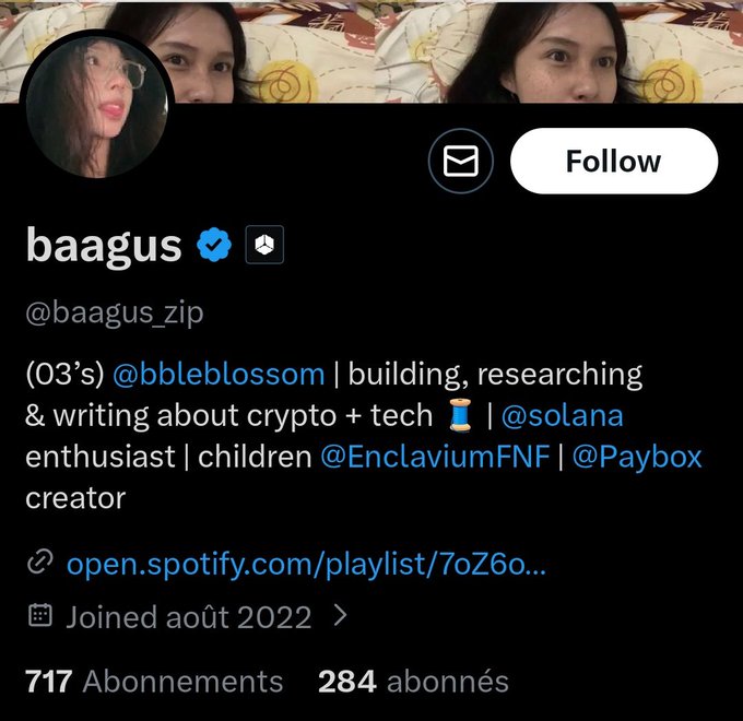 A Twitter/X profile page for 'baagus' (@baagus_zip) with a verified blue checkmark, describing themselves as building, researching & writing about crypto + tech, with mentions of @bbbleblossom, @solana, @EnclaviumFNF, and @Paybox; shows 717 subscriptions and 284 followers.