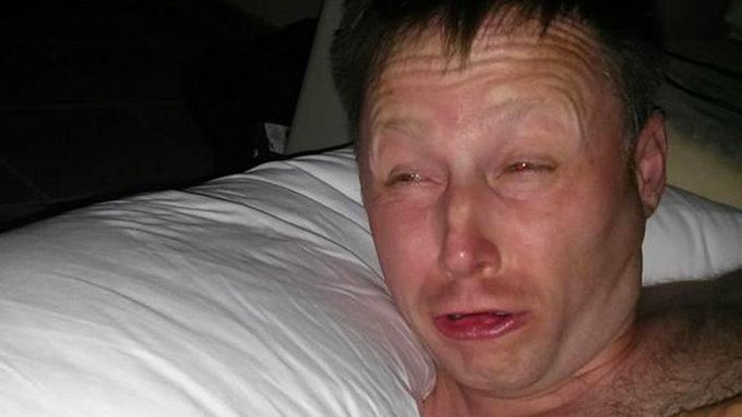 A man lies in bed with a distressed, teary-eyed expression, seemingly overwhelmed. The image humorously illustrates the post's sentiment of crypto investors experiencing emotional turmoil while reminiscing about the 2021 Terra Luna crash amid Solana's recent price surge.