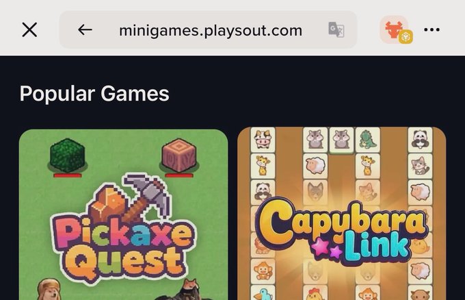 A mobile screenshot of 'minigames.playsout.com' showing a 'Popular Games' section featuring 'Pickaxe Quest' and 'Capybara Link' game thumbnails.
