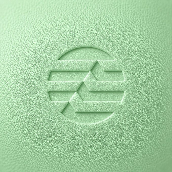 urn logo on a light green background, featuring a circle with three lines and a triangle inside.