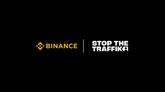 A black background displaying the yellow Binance logo next to the white 'STOP THE TRAFFIK' logo, separated by a vertical line.