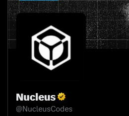 A dark profile card featuring a white hexagonal cube/crystal logo with the name 'Nucleus' and a verified checkmark, handle '@NucleusCodes'.
