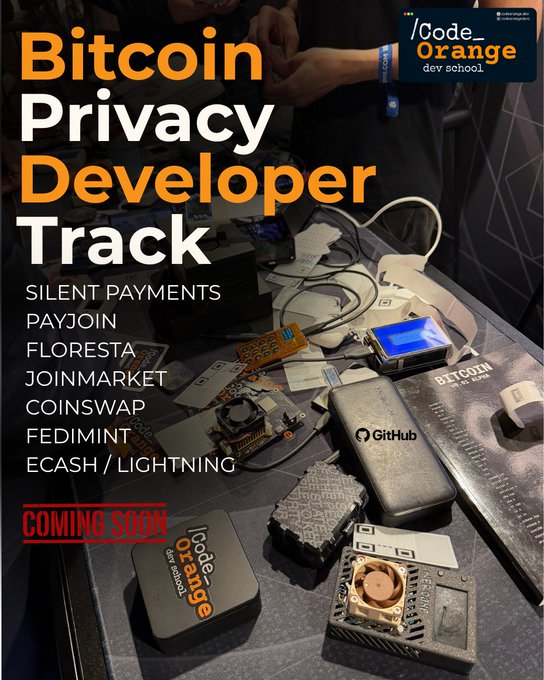 The image features a table with various electronic devices, including a computer monitor, keyboard, mouse, cell phone, and other items such as a wallet and a coin purse. The background of the image shows an orange banner that says "BITCOIN PRIVACY DEVELOPER TRACK". Below this banner is text that reads "Silent payments, Payjin, Floresta, Jojin market, CoinSwap @ payjoindevkit @ getfloresta @ joinmarket @ fedimint @ bitcoindevkit and more. Check out our bi-weekly curriculum on GitHub:". The image is related to the post because it showcases a table with electronic devices that are part of the privacy track's focus, which includes learning about silent payments, CoinSwap, and other aspects of making Bitcoin more private and censorship resistant.