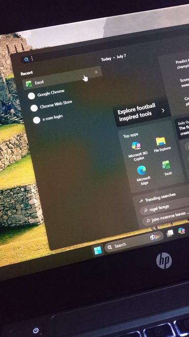 A photograph of an HP laptop screen displaying the Windows 11 Start menu with recent apps including Excel, Google Chrome, and File Explorer.