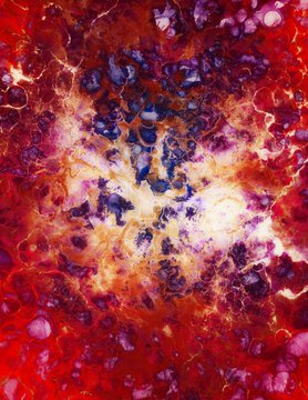 An abstract, swirling composition of vibrant red, orange, yellow, purple, and blue colors resembling a cosmic nebula or fiery liquid.