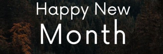 A text graphic with white letters reading 'Happy New Month' over a dark forest background with autumn foliage.