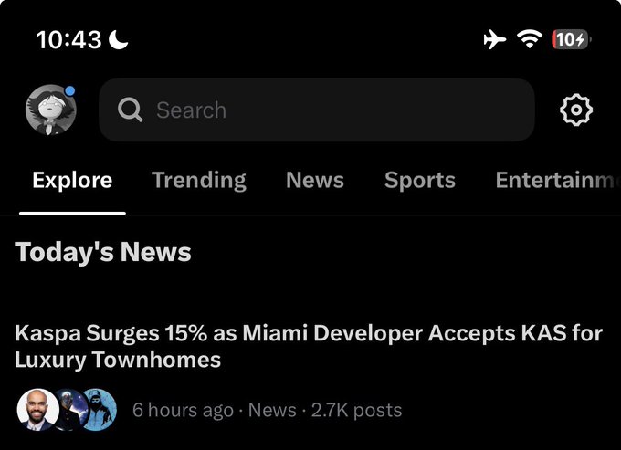 A screenshot of a dark-themed social media news feed showing a headline 'Kaspa Surges 15% as Miami Developer Accepts KAS for Luxury Townhomes' posted 6 hours ago.