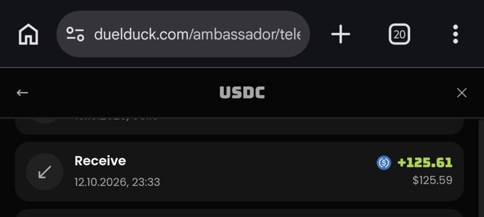 A mobile browser screenshot shows a USDC receive transaction of +125.61 (~$125.59) dated 12.10.2026, 23:33, with the URL duelduck.com/ambassador/tel visible in the address bar.