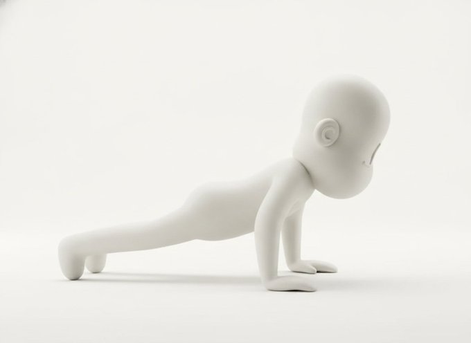 White matte figurine of a monkey in a push-up position with a stylized, oversized head and small spiral eyes.