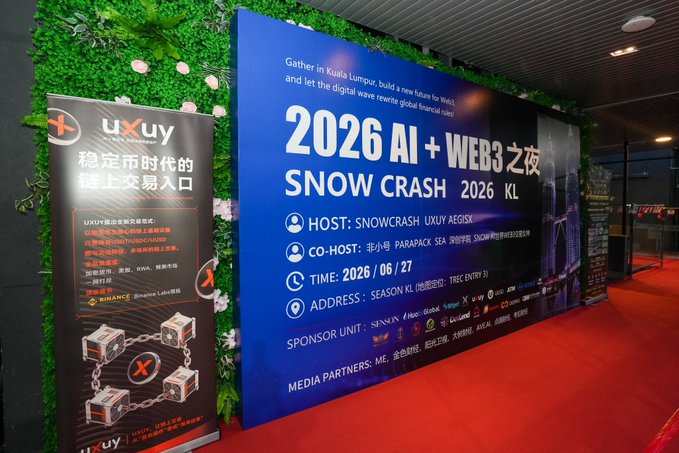 A promotional banner at the "2026 AI + WEB3之夜" (Snow Crash 2026 KL) event held in Kuala Lumpur on June 27, 2026, hosted by Snowcrash and UXUY Aegisix, with sponsorship from Binance. The image showcases the event entrance alongside UXUY branding, reflecting the company's role as a co-host and participant in the AI and digital finance gathering mentioned in the post.