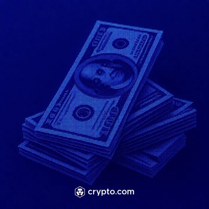 This image shows stacks of $100 bills in blue, with the crypto.com logo at the bottom, suggesting a shift towards digital currency.