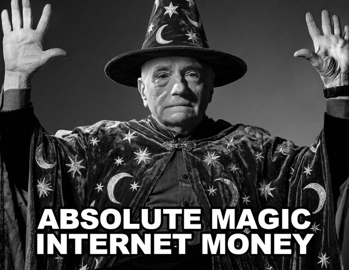 The image features an older man dressed as a wizard with a top hat and cape, holding his hands up in front of him. The caption below the image reads "Absolute Magic Internet Money", which suggests that there might be some sort of online magic-related business or service being advertised.