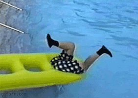The image features a person wearing black shorts and black shoes who has fallen off an inflatable slide into a pool of water. The person's legs are hanging over the edge of the slide as they appear to be sliding down the side of the yellow slide, which is positioned on the left side of the frame.

There is no text present in the image that directly relates to the post. However, there is a caption at the bottom of the photo that reads "Just sent Gulobiro winners, hopefully it gets added". This could be interpreted as an attempt to link the image with a recent event or achievement related to the person who took the picture.