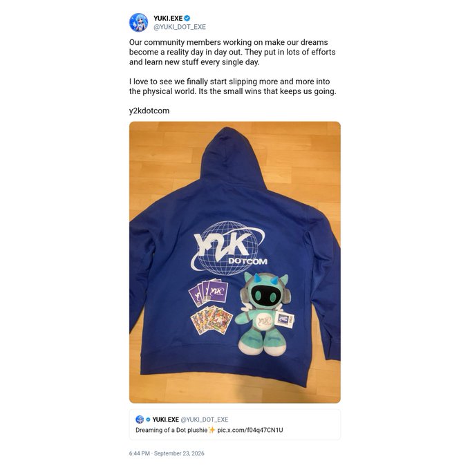 A tweet from YUKI.EXE (@YUKI_DOT_EXE) announcing a Y2K DOTCOM community merch drop, featuring a photo of a navy blue hoodie with the 'Y2K DOTCOM' logo and a plush toy placed on top.