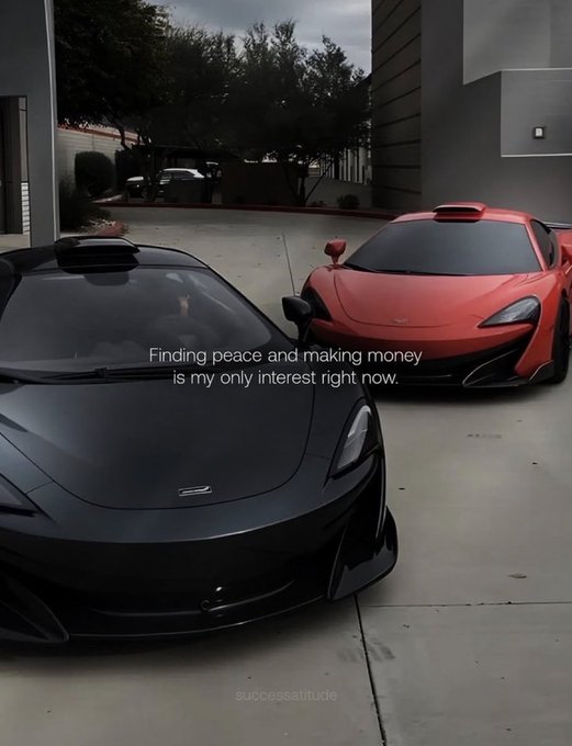 A black McLaren and a red McLaren sports car sit parked in a lot, with the text overlay "Finding peace and making money is my only interest right now" and "successattitude" displayed on screen. The luxury car imagery visually reinforces the motivational theme of financial success and ambition echoed in the accompanying "Good morning frens... Never stop clicking" message.