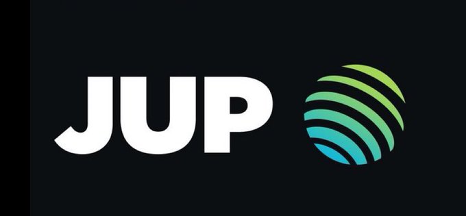 The image displays the "JUP" logo in bold white lettering alongside a circular icon featuring curved lines in a gradient of teal and green colors, set against a black background. This represents Jupiter (JUP), the cryptocurrency platform referenced in the post about its Q2 Active Staking Rewards (ASR) distribution, where 50M JUP will be allocated to eligible 50+ JUP stakers based on their weighted average stake from April–June.