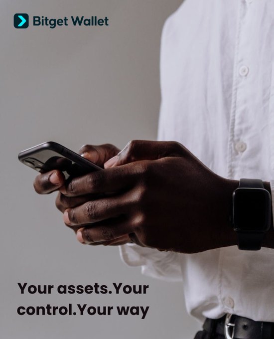 A man wearing a white shirt and black smartwatch uses his smartphone, with the "Bitget Wallet" logo in the top left and the tagline "Your assets. Your control. Your way" displayed prominently. The image reinforces the post's message by visually emphasizing personal control and ease of use, aligning with the call to download Bitget Wallet for seamless asset management.