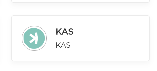 A digital wallet card displays the Kaspa (KAS) logo—a teal circle with a stylized "K" symbol—alongside the ticker "KAS" in bold and outlined text, representing Kaspa's listing as a accepted payment option on Travala.