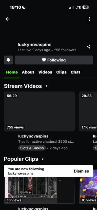 A screenshot of a Twitch channel page for 'luckynovaspins' showing 256 followers, a notification that 'You are now following luckynovaspins', and video thumbnails for slots and casino content.