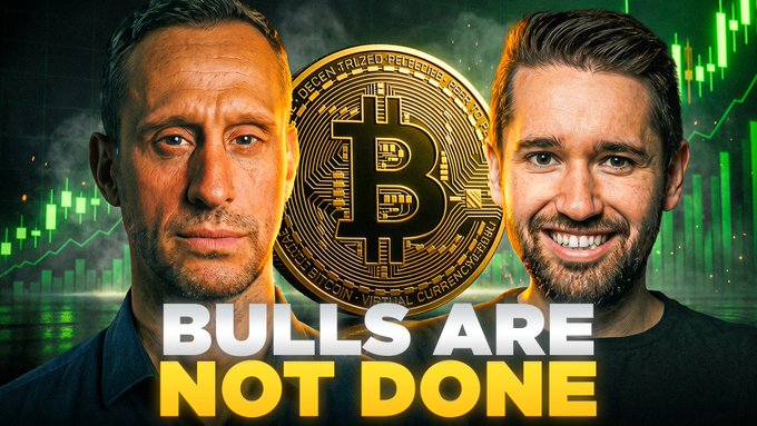 The image shows two men on either side of a large Bitcoin graphic with green candlestick charts in the background, overlaid with the text "BULLS ARE NOT DONE" — matching the post's bullish outlook on Bitcoin's rally following a key technical breakout, as discussed live with Joshua Frank at the Out East Summit.